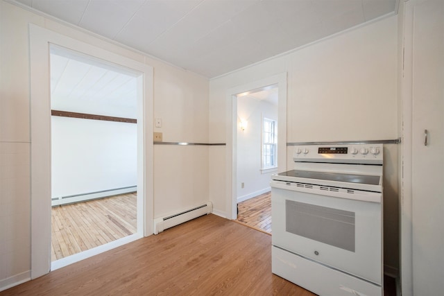 kitchen featuring a baseboard heating unit, light hardwood / wood-style floors, and white range with electric cooktop