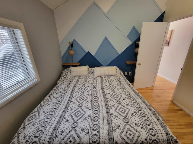 bedroom with hardwood / wood-style flooring