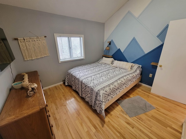 bedroom with hardwood / wood-style floors