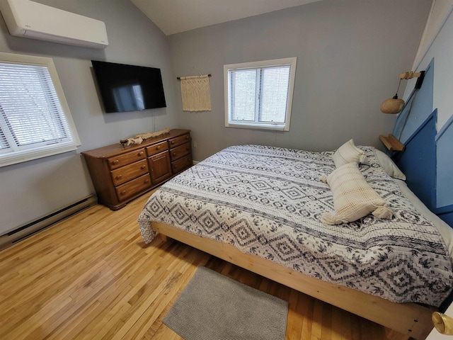 bedroom with lofted ceiling, a wall mounted air conditioner, light hardwood / wood-style flooring, and a baseboard heating unit