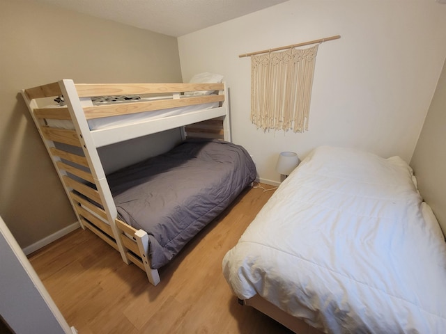 bedroom with light wood-type flooring