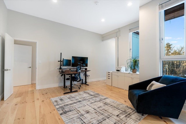 office space with light wood-type flooring