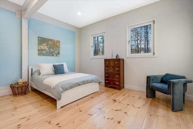 bedroom with hardwood / wood-style floors