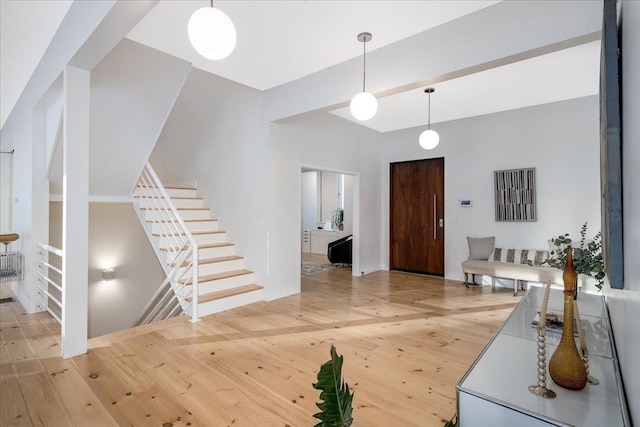 entrance foyer featuring wood-type flooring