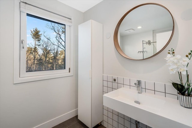 bathroom with sink, tile walls, and tile patterned floors