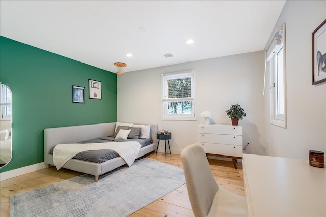 bedroom with light hardwood / wood-style floors