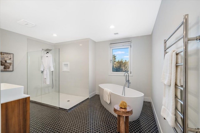 bathroom featuring vanity and separate shower and tub