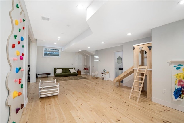 recreation room featuring light wood-type flooring