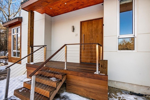 view of snow covered property entrance