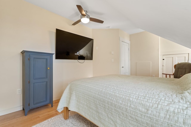 bedroom with ceiling fan and light wood-type flooring