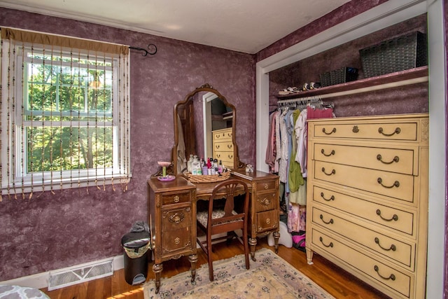 spacious closet featuring hardwood / wood-style flooring