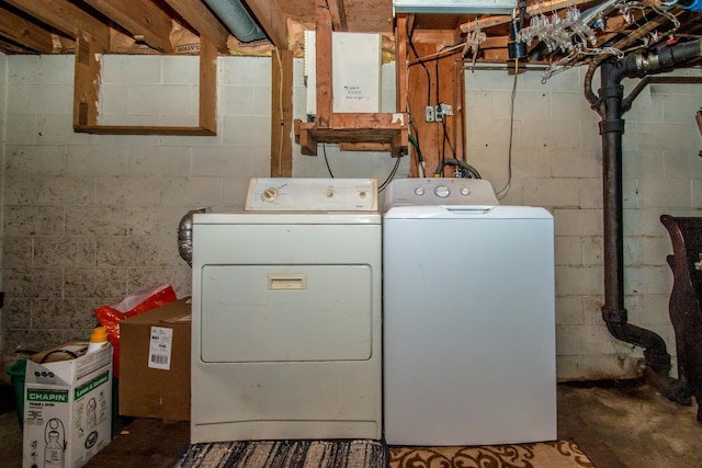 clothes washing area with washer and clothes dryer