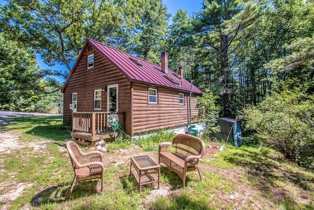 exterior space featuring a yard and an outbuilding