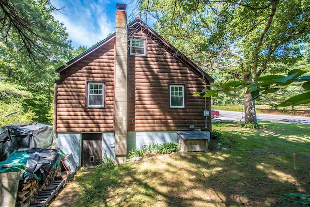 view of home's exterior with a lawn