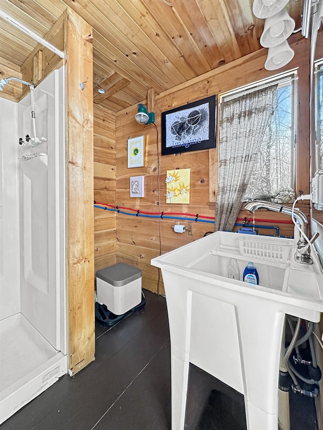 laundry area with wood walls and wooden ceiling