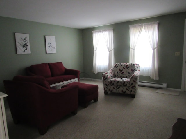 carpeted living room with a baseboard heating unit