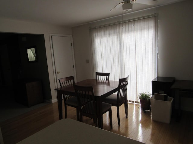 dining area featuring hardwood / wood-style floors and ceiling fan