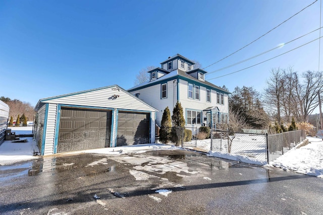 view of front of house featuring an outbuilding and a garage