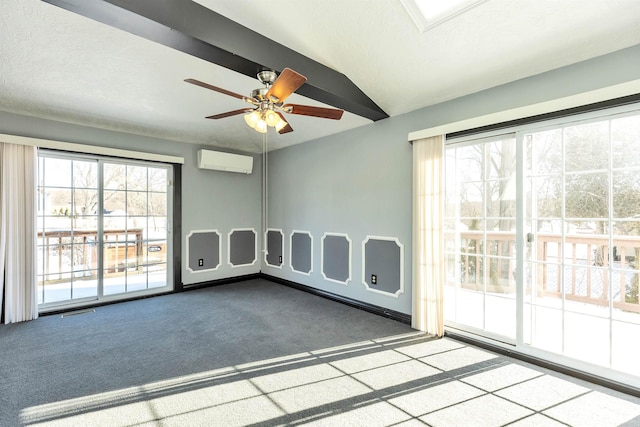 unfurnished room featuring lofted ceiling, ceiling fan, a wall unit AC, carpet, and a textured ceiling