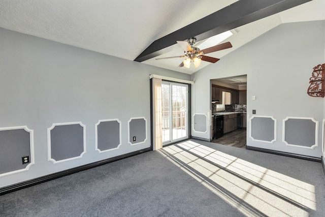 carpeted empty room with ceiling fan and vaulted ceiling