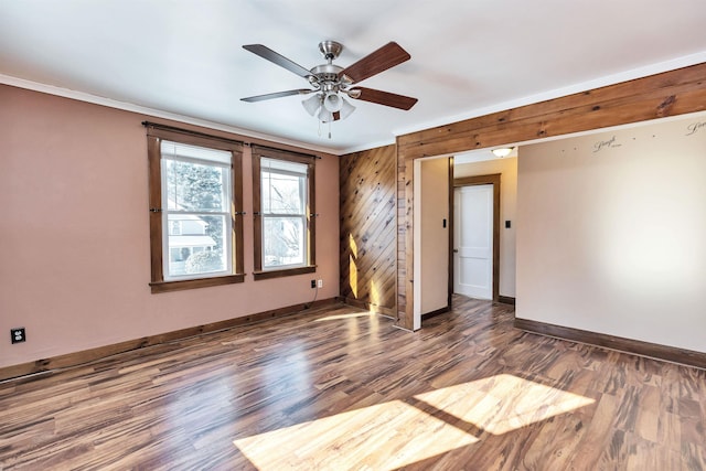 spare room featuring hardwood / wood-style flooring, ceiling fan, and ornamental molding