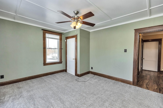 carpeted empty room with ornamental molding and ceiling fan