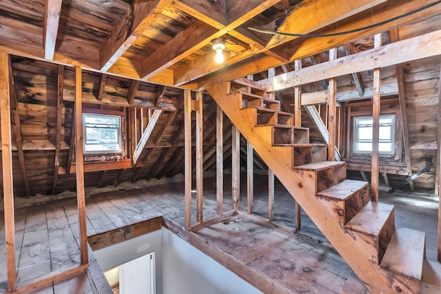 unfinished attic featuring plenty of natural light