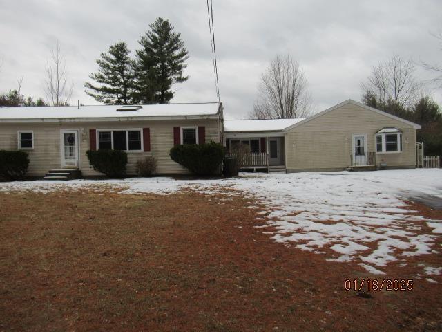 view of snow covered house