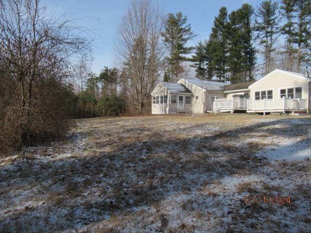 view of yard with a wooden deck