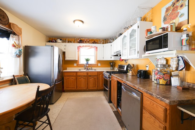 kitchen with white cabinetry, sink, and appliances with stainless steel finishes