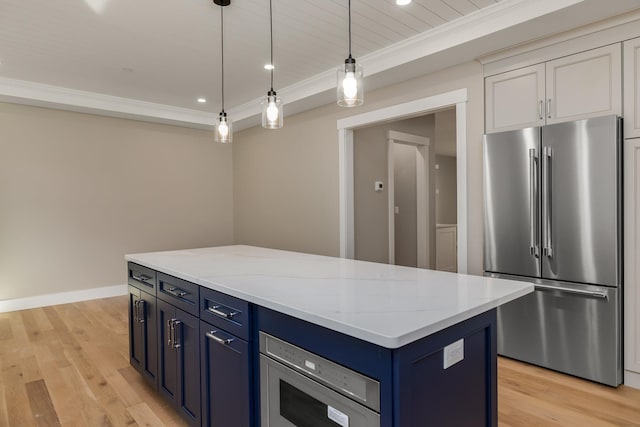 kitchen featuring pendant lighting, a kitchen island, stainless steel appliances, light stone counters, and blue cabinets