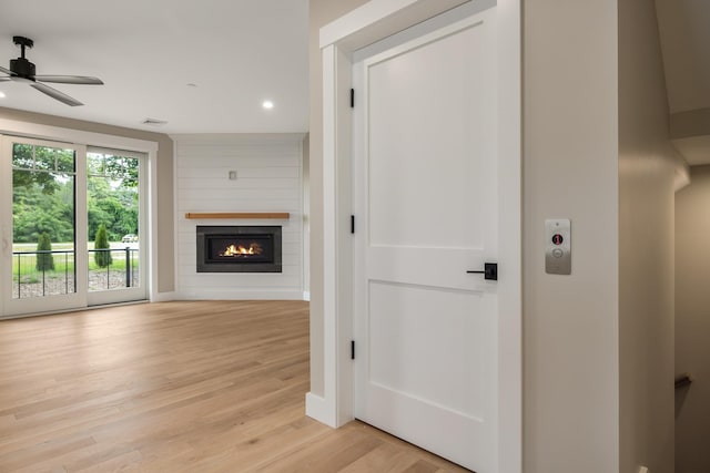 hall with light hardwood / wood-style floors