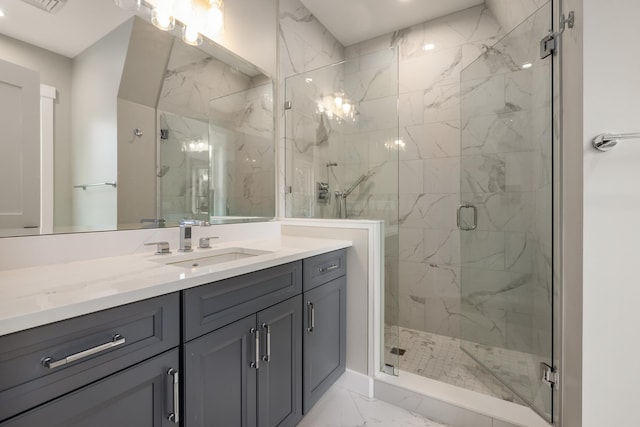 bathroom with a shower with door and vanity