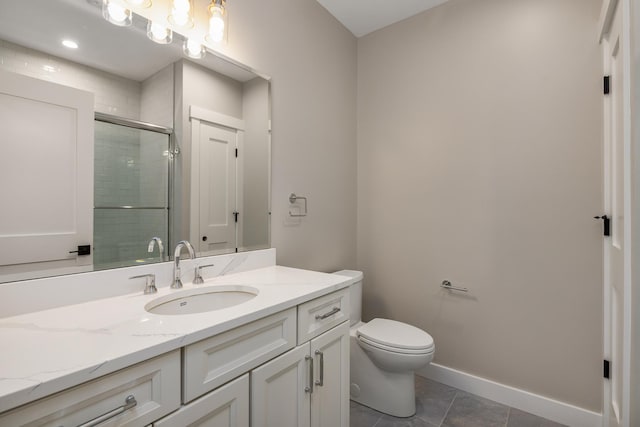 bathroom with tile patterned flooring, vanity, walk in shower, and toilet