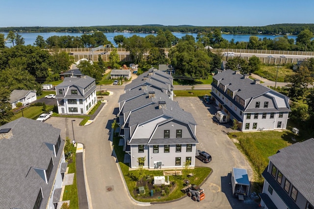 birds eye view of property with a water view