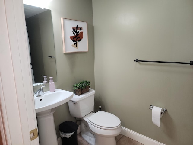 bathroom featuring tile patterned flooring, sink, and toilet