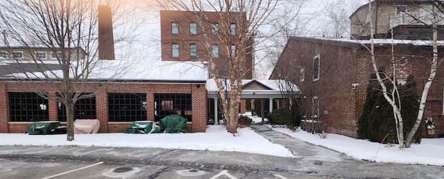 view of snow covered property