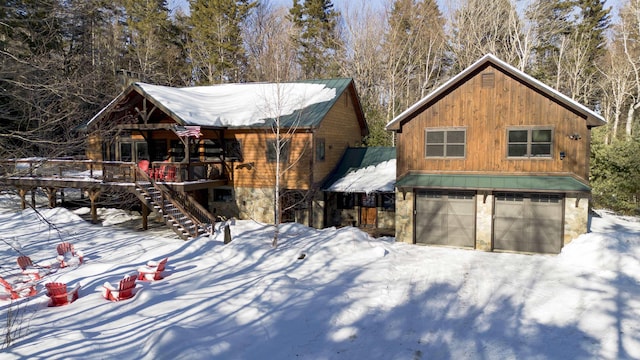 view of front facade with a garage and covered porch