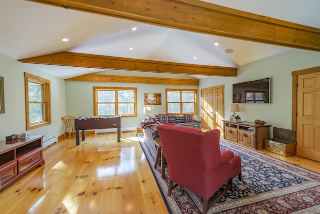 living room featuring vaulted ceiling with beams, light hardwood / wood-style flooring, and a baseboard heating unit