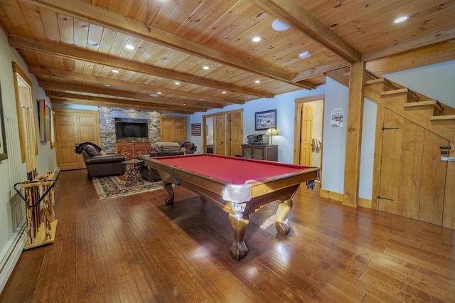 recreation room featuring wooden ceiling, hardwood / wood-style floors, and a baseboard heating unit