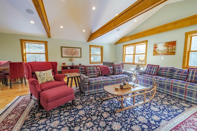 living room featuring hardwood / wood-style floors and lofted ceiling with beams