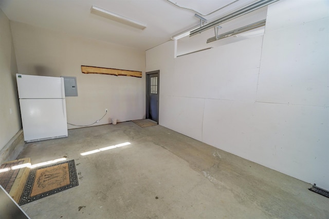 garage with white fridge and electric panel