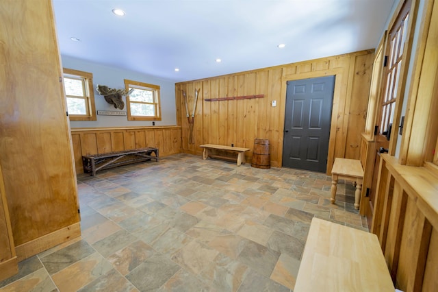 interior space featuring wood walls