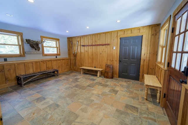 entrance foyer with wood walls