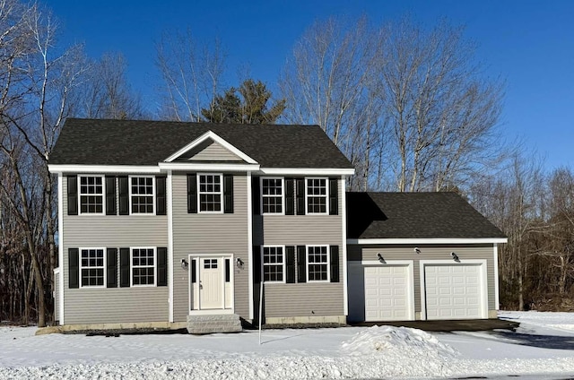 colonial home with a garage