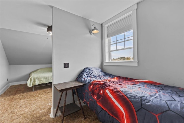 bedroom featuring lofted ceiling