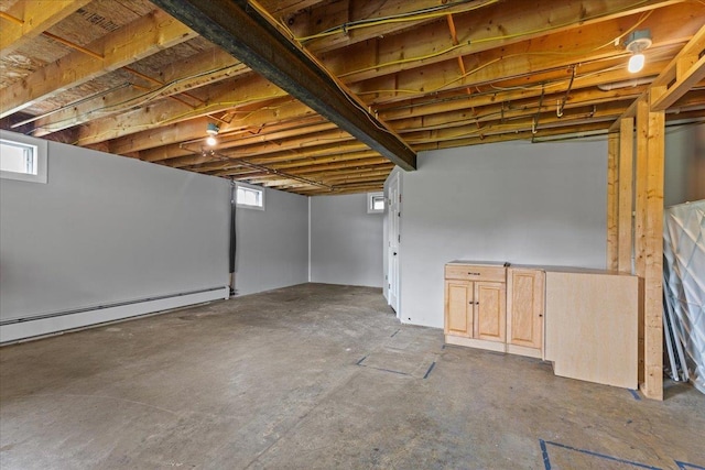 basement featuring a baseboard radiator