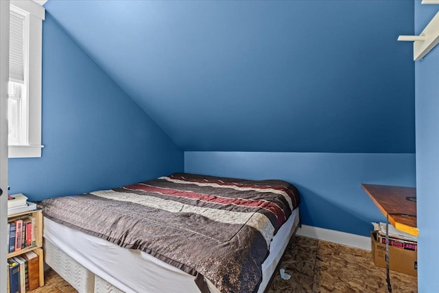 bedroom featuring lofted ceiling