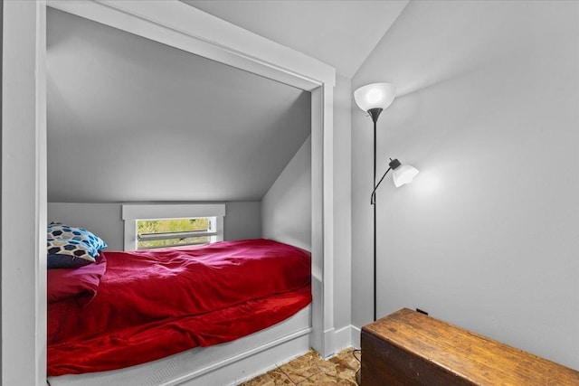 bedroom featuring vaulted ceiling