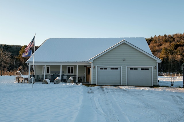 view of front of property featuring a porch and a garage